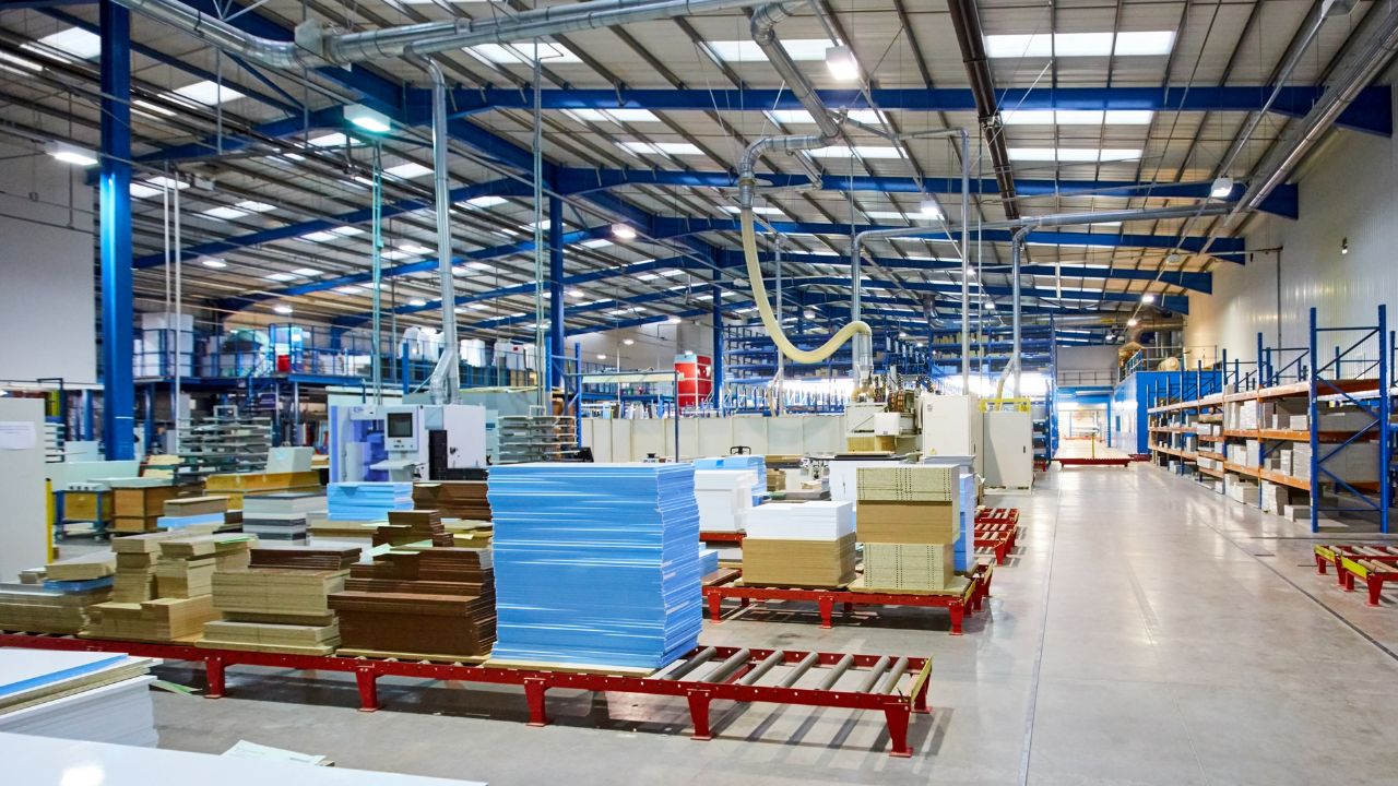 UK manufacturing unit with concrete floors and stacks of products