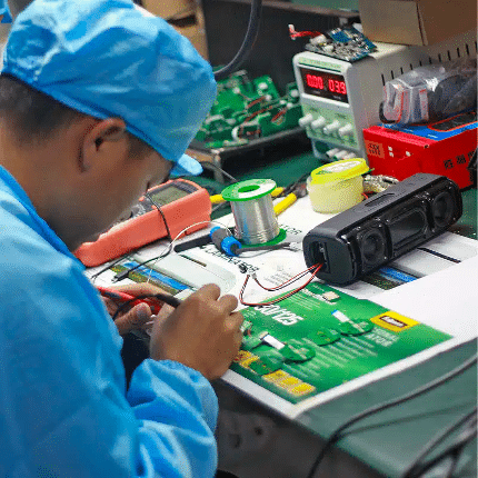 D2M technician working on a prototype